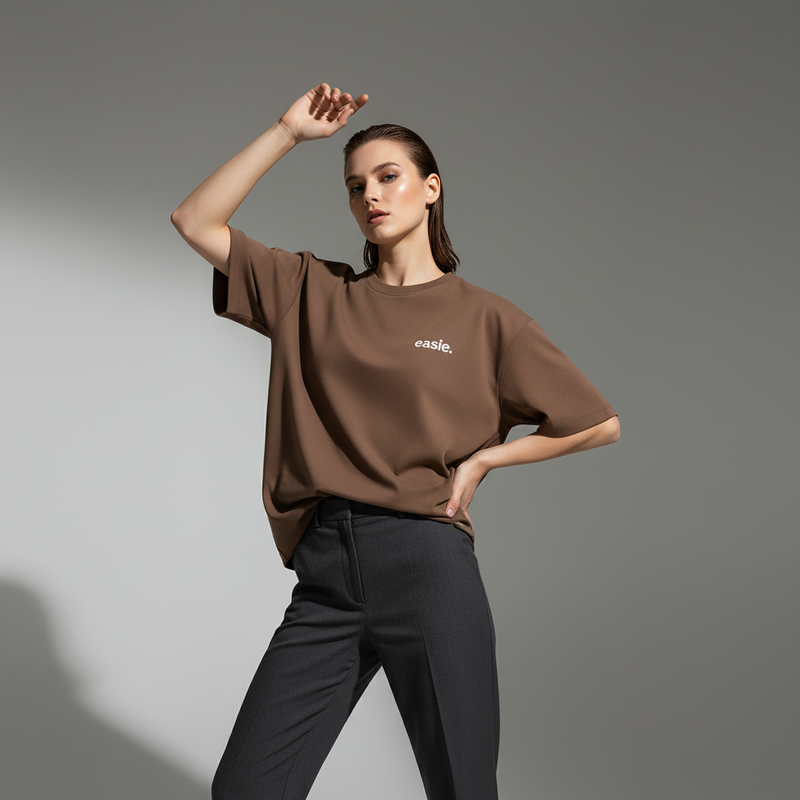 Female Model wearing Ease Essentials Oversized Tee (Brown)